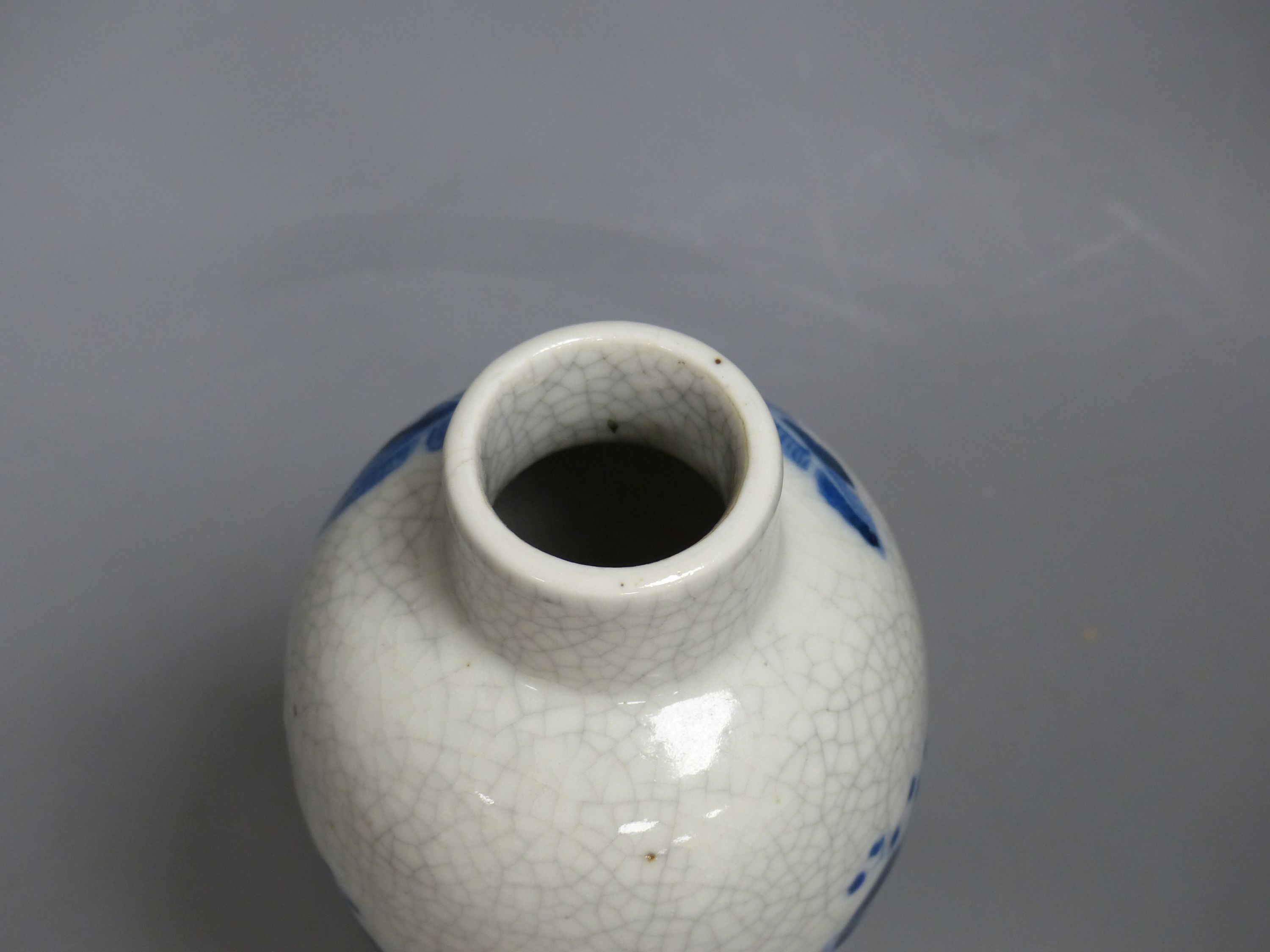 A late 19th century Chinese blue and white crackle glaze vase and cover, height 27cm